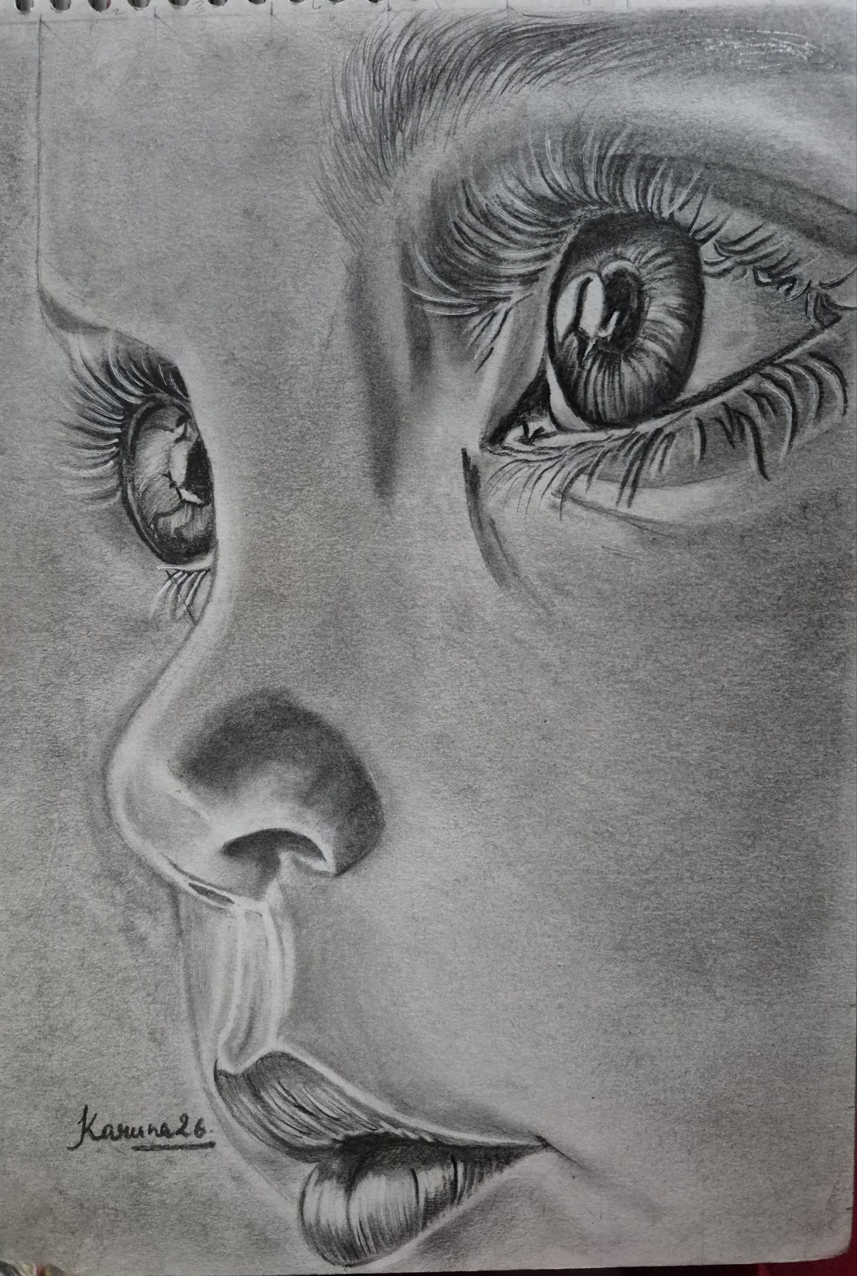 Highly realistic graphite sketch showing the innocent face of a wide-eyed young child