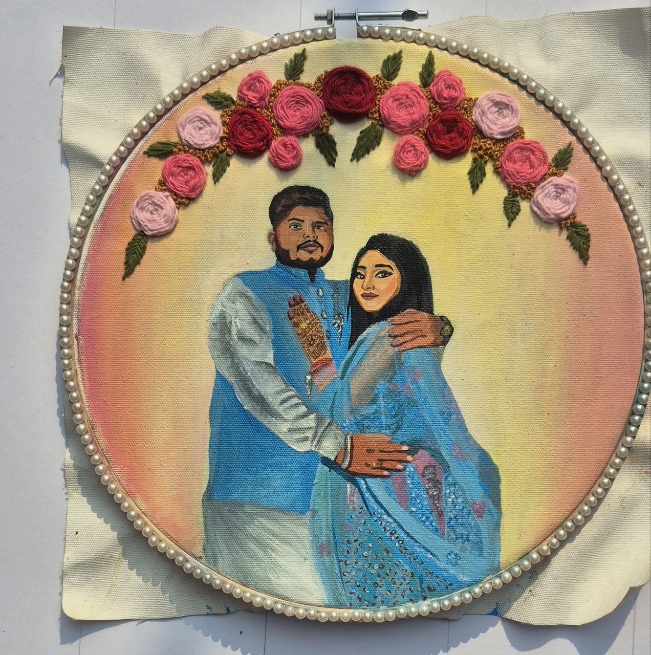 Unique mixed media painting of a wedding couple stretched inside an embroidery hoop decorated with 3D embroidered flowers